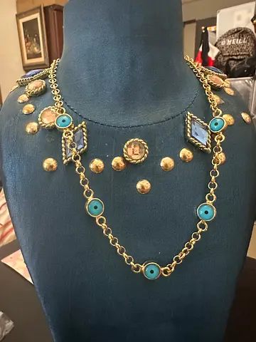 Gold-tone necklace with blue evil eye and medallion charms non tarnished 10k plated