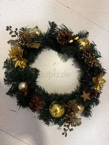 Green Christmas Wreath with Gold Ornaments and Pinecones