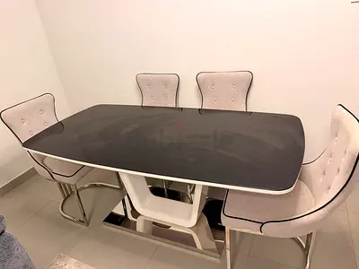 Modern glass-top dining table with 4 upholstered chairs pls don’t waste your time or mine for low