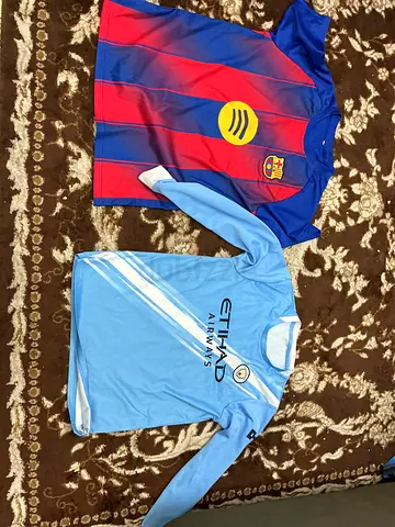 Two Kids Football Jerseys - Barcelona and Manchester City, Size Small