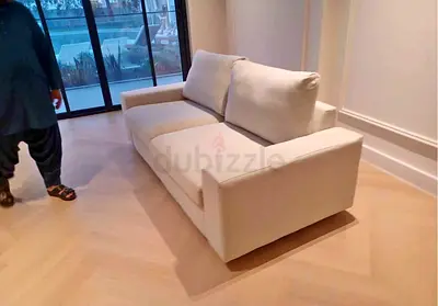 Light beige 2-seater sofa bed in good condition