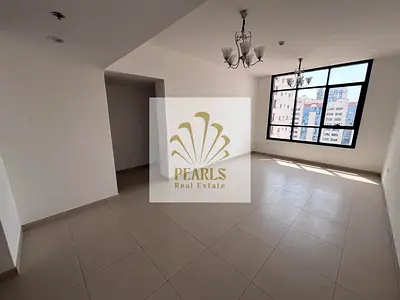 A spacious 2-bedroom apartment with a living room is available for annual rent in Ajman, located on