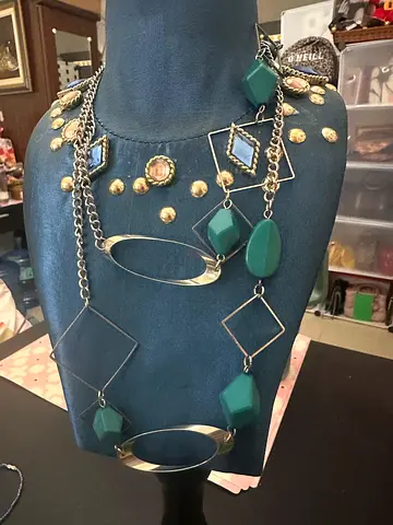 Long geometric pendant necklace with teal and silver accents