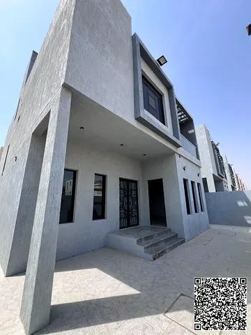 located in a prime location on a main street and an internal road. The villa features a modern desi
