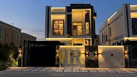 A spacious family villa with a practical layout in Muwayhat 3, situated on a street and a service ro