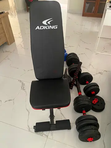 Adjustable ADKING weight bench with dumbbells and barbell set - good condition