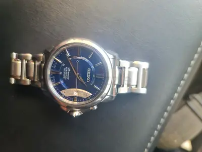 Seiko Premier Kinetic men's stainless steel watch with blue dial