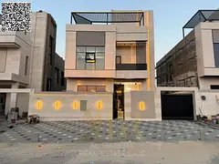 A dream villa in Al Helio, Ajman, featuring an elegant design, high-end finishes, and a location clo