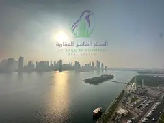 Spacious 3-bedroom apartment in Al Majaz 1, Sharjah, featuring 4 bathrooms and a laundry room. Prim