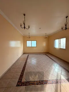 A spacious two-bedroom apartment is available for annual rent in Al Butina, Sharjah, with an excelle