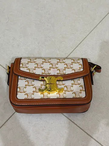 Small brown & white patterned shoulder bag with gold clasp