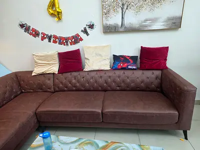 Brown L-shaped Faux Leather Sofa — Good Condition