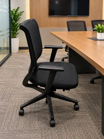 Ergonomic Black Office Chair with Armrests and Casters - Good Condition