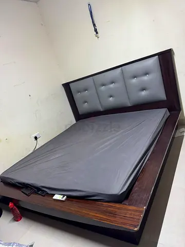 Queen wooden bed frame with upholstered headboard and mattress