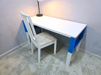 Simple white study desk with blue accents — good condition