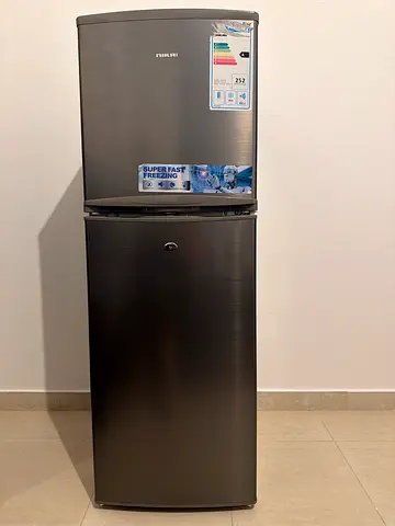 Used two-door refrigerator with top freezer - good condition