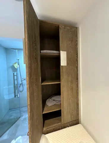 Tall wooden wardrobe / linen cupboard - good condition