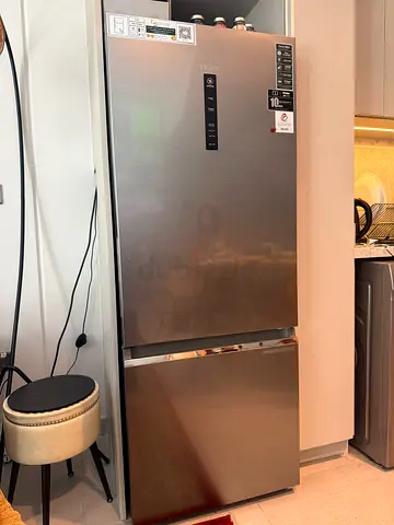 Stainless steel bottom-freezer refrigerator in good condition