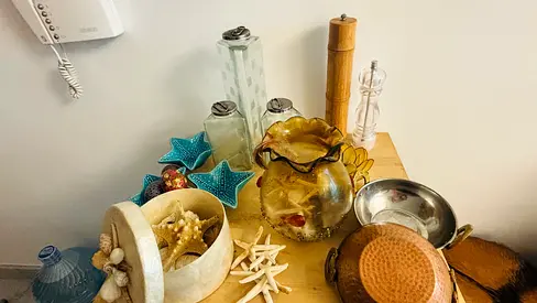 Mixed home decor lot — vases, bowls, glassware and decorative shells