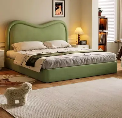 Modern green upholstered double bed with curved headboard