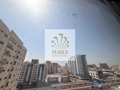 2 BHK on Al Ittihad Rd (near Day to Day): large hall, 2 baths, central AC, free parking, 1 mo FREE, 4-6 cheques, AED 3k check dep, AED 42k.