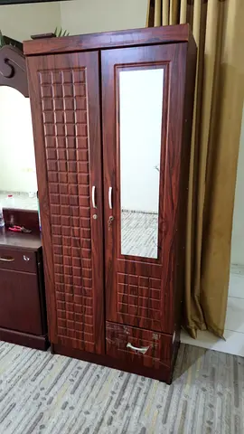 Two-door wooden wardrobe with mirror — good condition