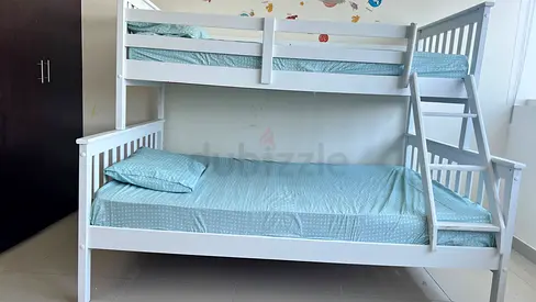 White wooden bunk bed with matresses