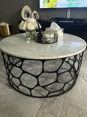 Round Marble-Top Coffee Table with Black Geometric Base