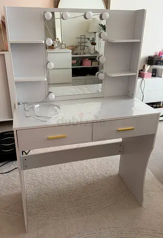 White makeup table with shelves and mirror