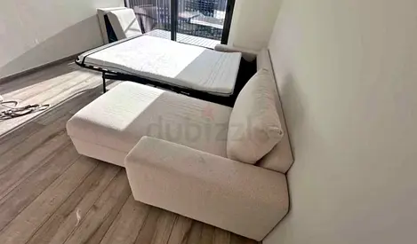 Light beige fabric sofa bed  chaise lounge, good condition