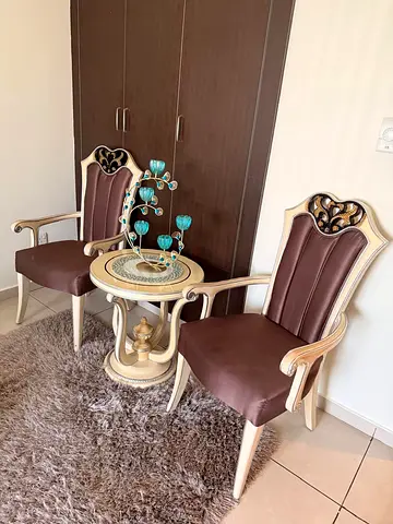 Pair of classic wooden armchairs with side table - good condition