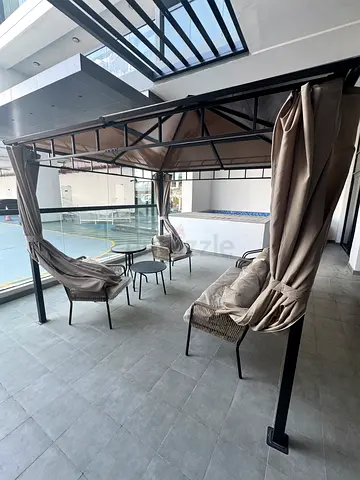 Outdoor gazebo pergola with curtains and seating - good condition
