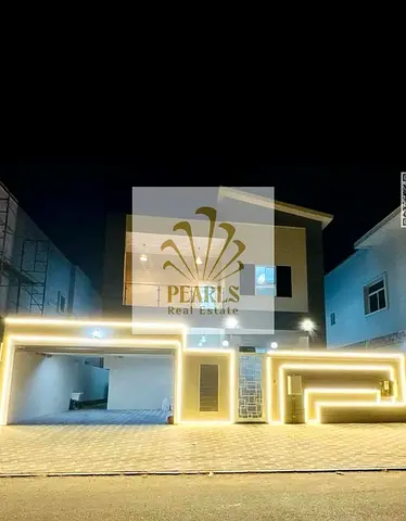 A spacious villa is available for annual rent in Al Yasmeen, Ajman. It features 5 bedrooms, 8 bathr