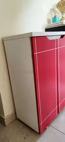 Compact red and white storage cabinet - good condition