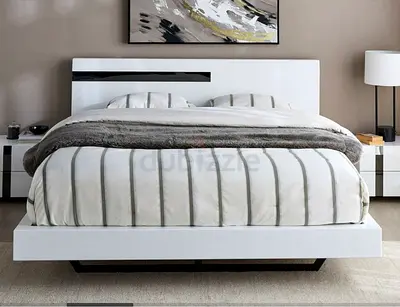 bedroom set with queen bed, night stand and six drawer dresser.