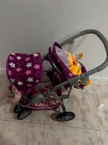 Used purple toy baby stroller/pram with storage basket x 2 piece