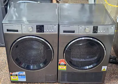 Front-load washer and dryer 10kg and 9kg set (matching stainless finish) - good condition