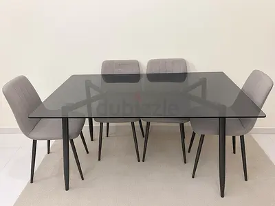 Glass Top Dining Table with 6 Grey Upholstered Chairs