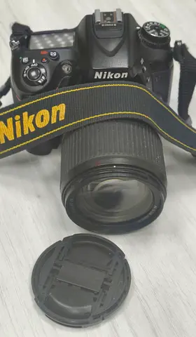 Nikon D7100 DSLR camera bundle paired with a Nikon DSLR with 18-105mm VR lens - used, good condition