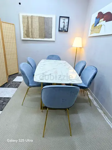 Marble-top dining table with 6 velvet chairs - good condition