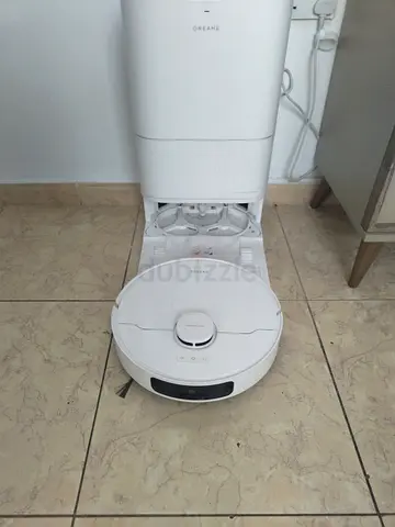 White robot vacuum with automatic mop and docking station — good condition