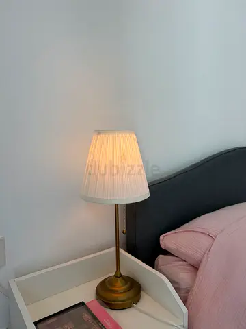 Brass bedside table lamp with pleated white shade - good condition