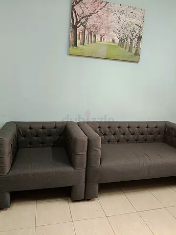 Dark grey tufted 3-seater sofa and matching armchair set