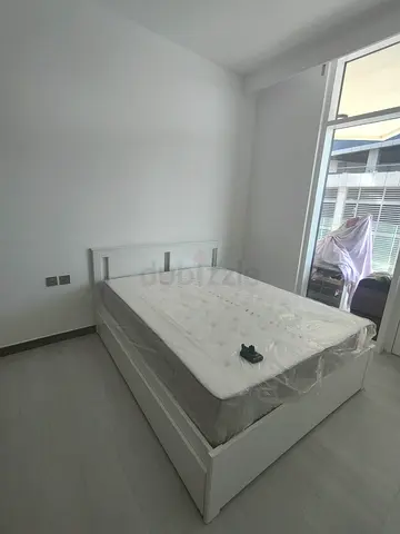 IKEA White wooden double bed frame — good condition (Mattress not included)
