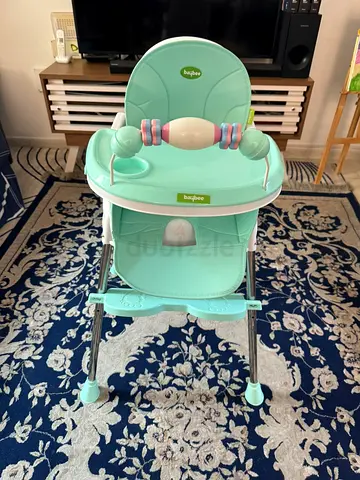 Mint green baby high chair with toy bar — new