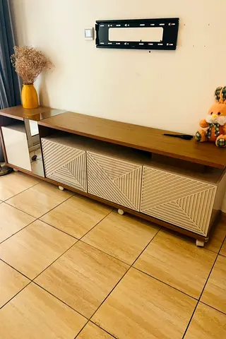 Wooden TV Console Cabinet with Patterned Sliding Doors - Good Condition