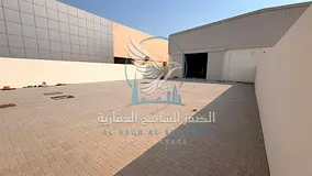 Yard for rent in Sharjah, 10,000 sq ft with a 3,000 sq ft warehouse, 50 KW power, office, bathroom a