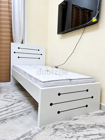 Brand new single wood Bed including mattress available