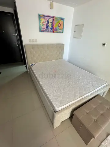 Queen size bed frame with mattress and storage ottoman - good condition