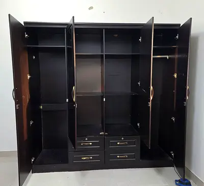 Dark wood 4-door wardrobe with drawers and hanging space